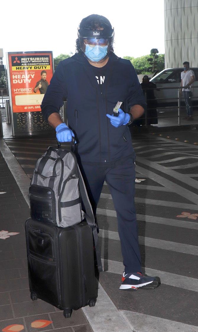 R Madhavan was spotted by the shutterbugs taking all necessary precautions at the Mumbai airport. All pictures/Yogen Shah