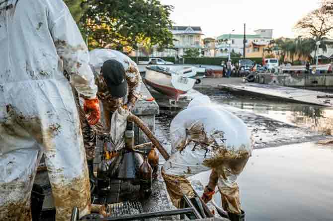 Even as Jugnauth has declared the oil spill a national emergency, some residents say he acted too late.
In picture: Fishermen and skippers tend to a makeshift oil extraction device at the Mahebourg waterfront in Mauritius.