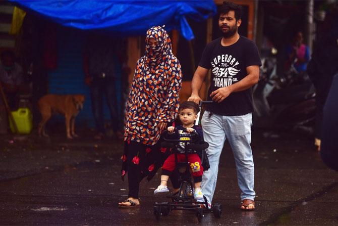 In photo: A couple clicked with their child at Byculla in South Mumbai.