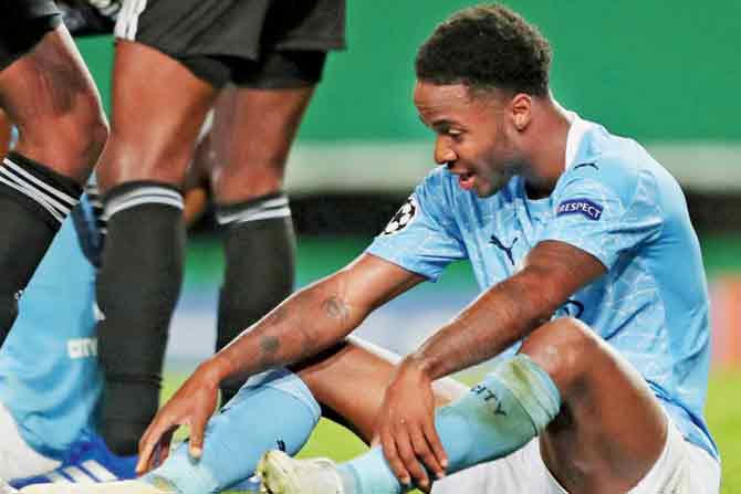 City’s Raheem Sterling (left) and Gabriel Jesus are distraught 