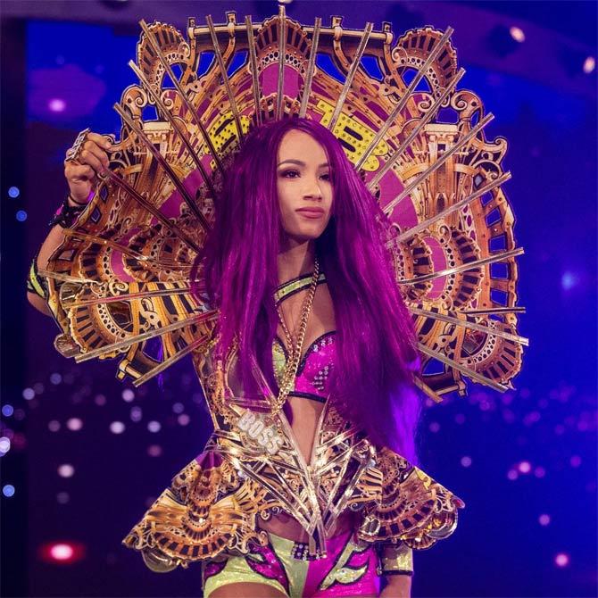 Sasha Banks - 'The Boss' of the women's division in WWE, Sasha made her SummerSlam debut in 2015 in the same tag-team match as Charlotte which she and her team lost. She went on to lose her Raw women's title the following year to Charlotte at SummerSlam. Sasha Banks is a record five-time and current Raw women's champion, an NXT women's champion and two-time and current tag-team women's champion.