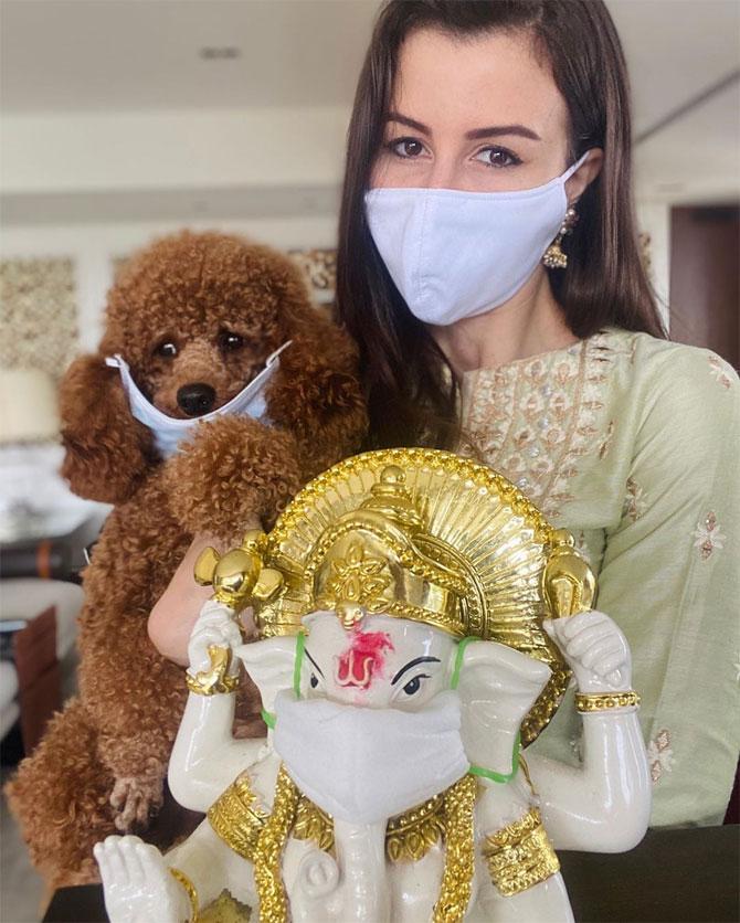 Giorgia Andriani took to Instagram to share a picture of hers and her pet with Ganesh idol, all three donning mask. She wrote in the caption, 