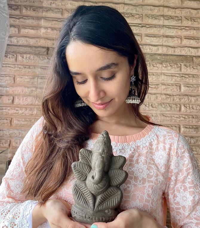 Shraddha Kapoor's favourite festival is Ganesh Chaturthi. Even if the actor has a busy schedule, she always makes it a point to celebrate the festival with her loved ones. Kapoor welcomed Lord Ganesha at her aunt Padmini Kolhapure's residence and was snapped posing with an eco-friendly Ganpati idol, enjoying it to the fullest. She wrote in the caption, 