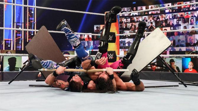 Seth Rollins would show off his in-ring experience against a rookie Dominik. Rollins would then be at the receiving end of Kendo stick attacks and a frogsplash from Dominik. Rollins was event sent crashing through the table in the ring, but managed to kick out.