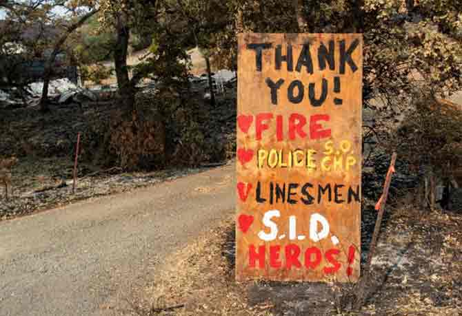 In picture: A sign thanking first responders is put up on a driveway in Bucktown, California.