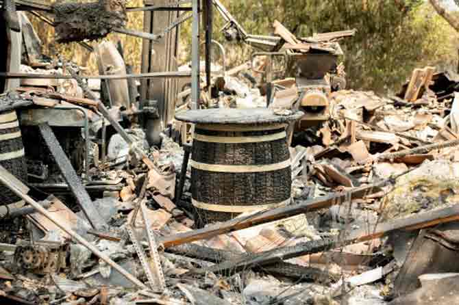 A fire in wine country north of San Francisco and another southeast of the city have within a week grown to be two of the three largest fires in state history, with both burning 1,295 square kilometres.
In picture: A wine barrel among the charred remains of the La Borgata Winery in Vacaville, California.