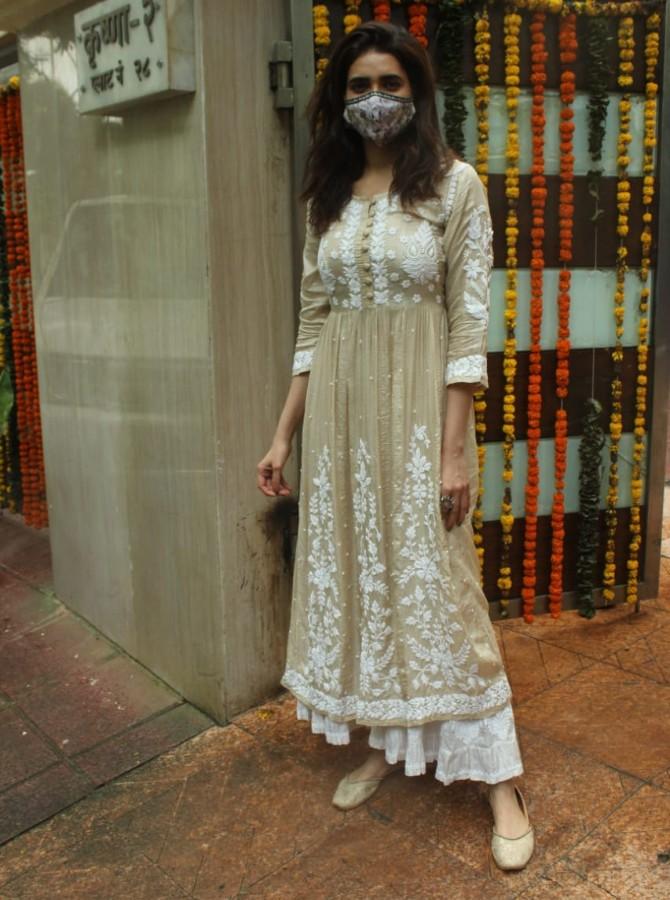 Karishma Tanna also marked her presence at the event. She looked beautiful in her traditional cream-coloured dress, golden slippers and a designer mask.