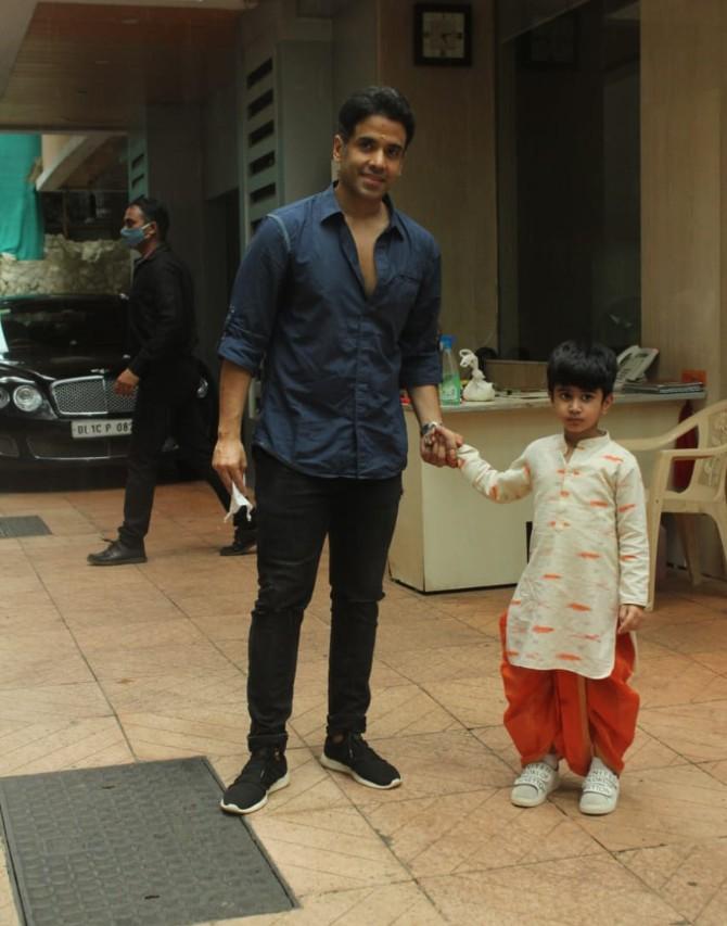 Tusshar Kapoor snapped with his son Laksshya. For the event, the actor opted for a blue shirt, black pants and black sneakers.