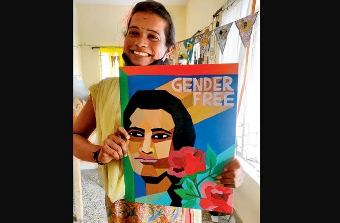 An artist holding her artwork that seeks to promote inclusion