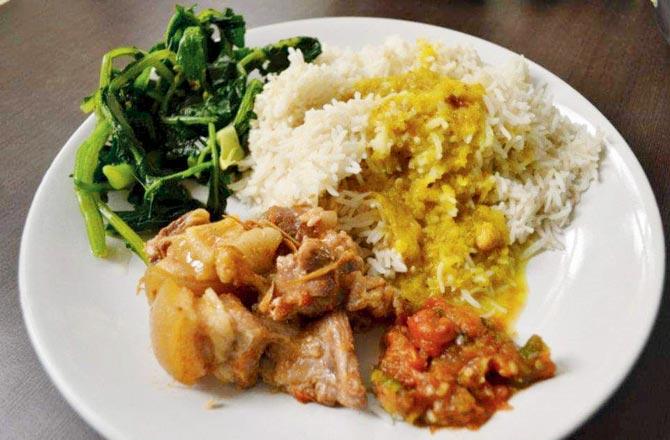 Plain boiled rice, dal (without tadka), boiled vegetables, pork cooked in bamboo shoot and bhut jolokia and axone chutney made by Tituraj Kashyap Das