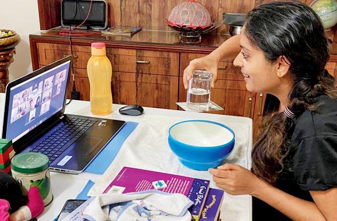 Educator Raashi Jain demonstrates an experiment for science through stories camp