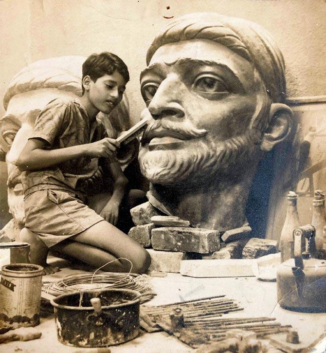 Deco sculptor NG Pansare-s son Kiran putting finishing touches to his father’s famous bronze statue installed at Shivaji Park in 1966. Pic Courtesy Art Deco Mumbai Trust, Pansare Family Archive