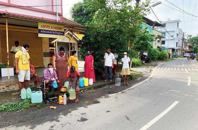 As the wells are contaminated, villagers have to go to a communal civic tap to fill wate