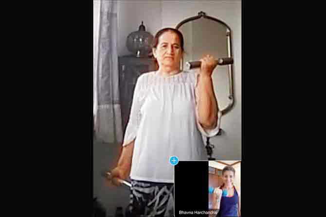 Bhavna Harchandrai conducts a  one-on-one virtual fitness workout session with a client