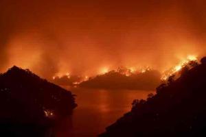 In photos: California wildfires burn through homes, forest