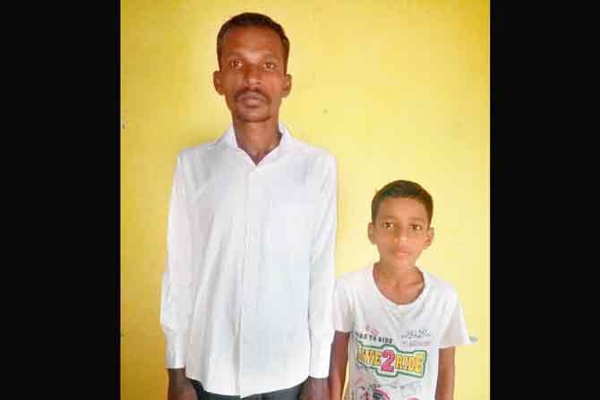 Rajesh Babare, a Dharavi resident (with son Aryan)