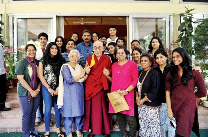 Mehta (in blue) meets the Dalai Lama during a trip to Dharamshala