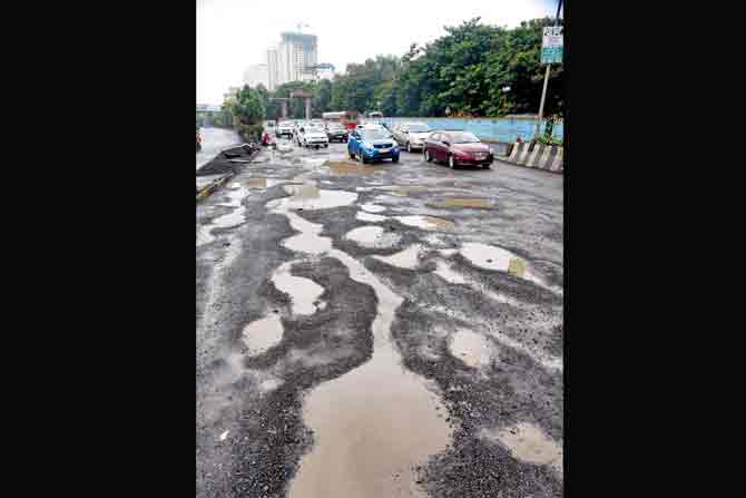 Motorists had claimed the pothole-ridden road was dangerous. PIC/Sameer Markande; (inset) mid-day’s report on August 18