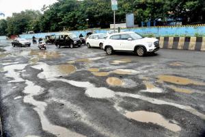 Highway or crater gully? Potholes cause problems for motorists