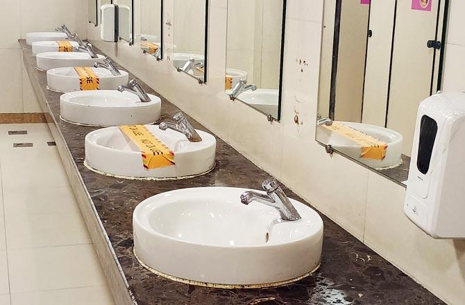 Alternate washbasins sealed to maintain social distancing