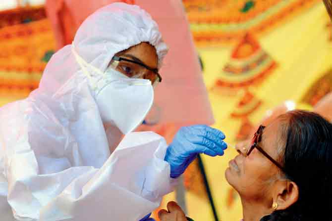 A Kandivli resident gets tested for COVID-19 at a civic camp. PIC/SATEJ SHINDE 