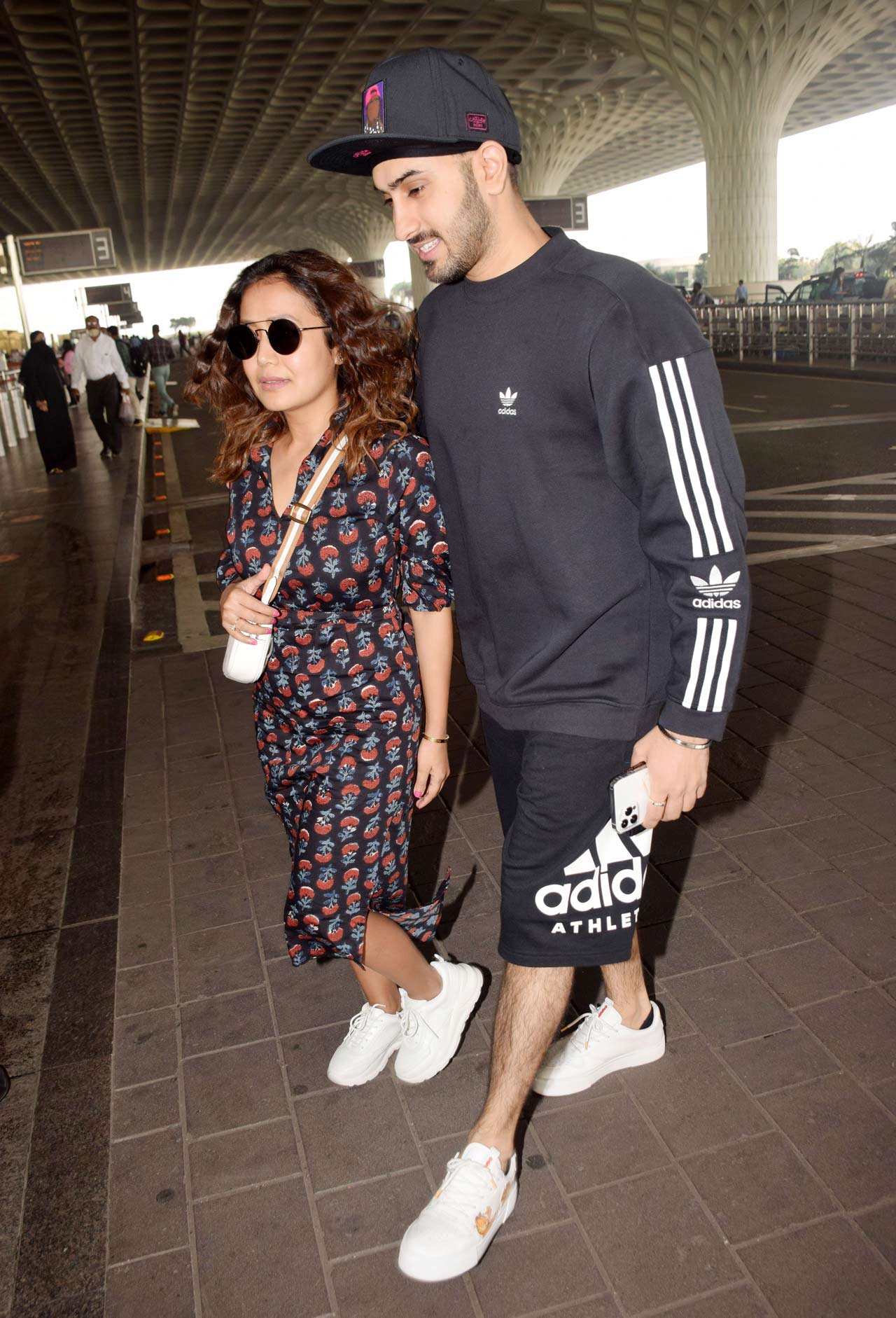 Neha Kakkar and Rohanpreet Singh were clicked at the Mumbai airport by the shutterbugs. While Neha opted fora a black shirt dress, Rohanpreet sported a casual look when snapped at the airport. All pictures/Yogen Shah