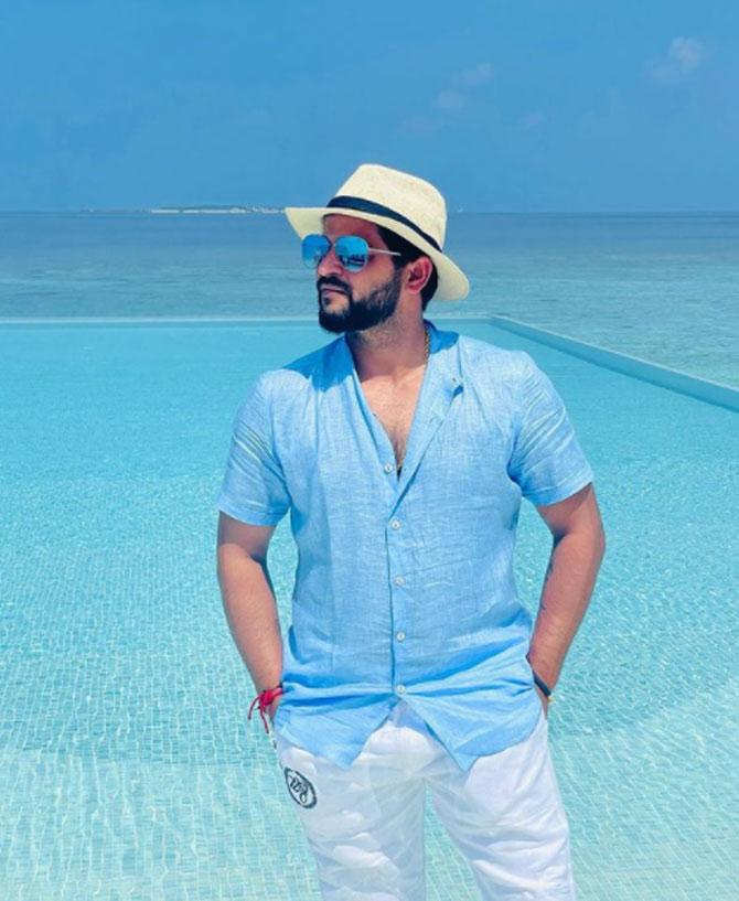 Sharing a stunning photo of him posing in a light blue shirt, white trousers, blue shades and a cool hat with a breathtaking view at the back, Raina wrote: Endless ocean & peace. True beauty of nature. @heritanceaarah.