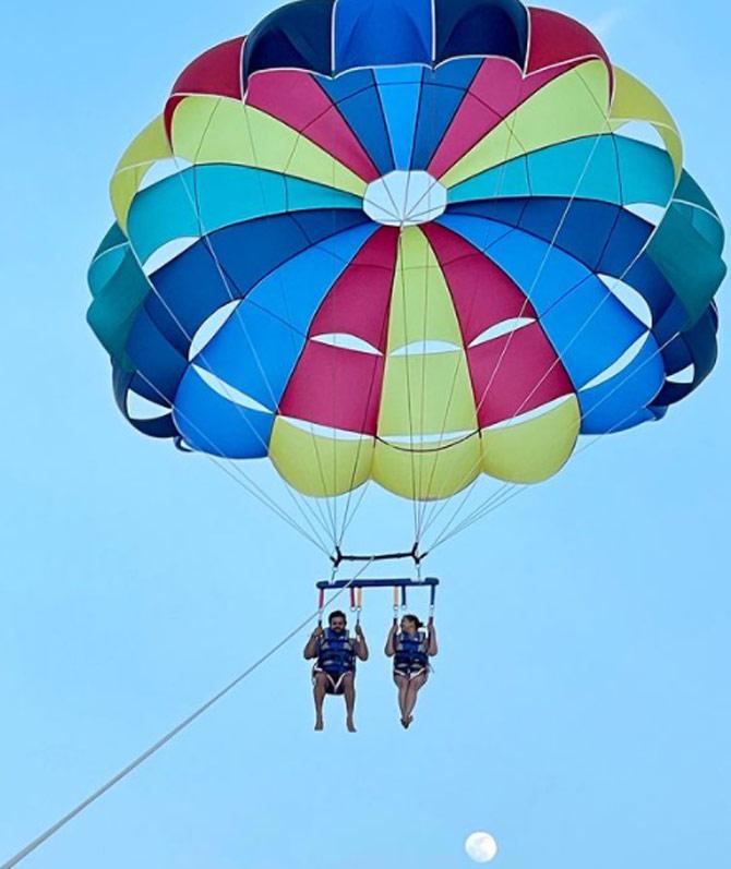 Suresh Raina and Priyanka clearly are an adventurous couple. Priyanka shared a photo of them going parasailing. She captioned the photo: Up, up, above the moon! @sureshraina3