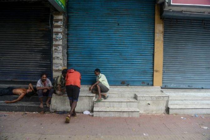 March 24: : India goes into lockdown: Rickshaw pullers rest in front of closed shops during a state-imposed lockdown as a preventive measure against the surge in COVID-19 coronavirus cases in Siliguri, West Bengal 
