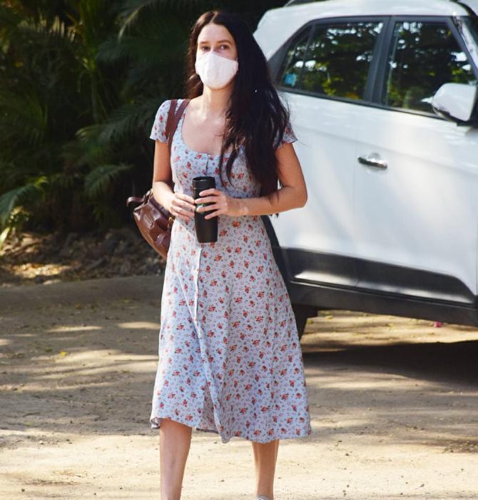 Katrina Kaif's younger sister Isabelle Kaif was clicked by the paparazzi at Veda Factory Studio in Andheri, Mumbai. For the outing, the star opted for a grey dotted dress and a brown handbag. She wore a white protective mask to prevent the spread of COVID-19. (All pictures: Yogen Shah).