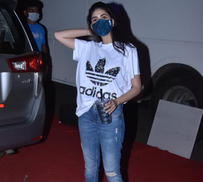 Sanjana Sanghi who made her Bollywood debut opposite late Sushant Singh Rajput in Dil Bechara was snapped at the Film City. The actress sizzled in her white top and ripped jeans for the outing. Sanjana will be next seen opposite Aditya Roy Kapur in OM - The Battle Within.