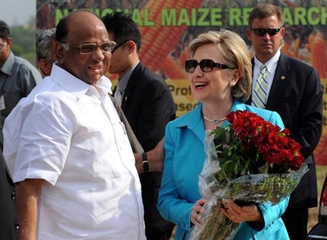 In 2017, Sharad Pawar was honoured with the Padma Vibhushan, India's second-highest civilian award.
In picture: Sharad Pawar, presents a bouquet to US Secretary of State Hillary Clinton during her visit to the Indian Agricultural Research Institute (IARI) in New Delhi on July 19, 2009.