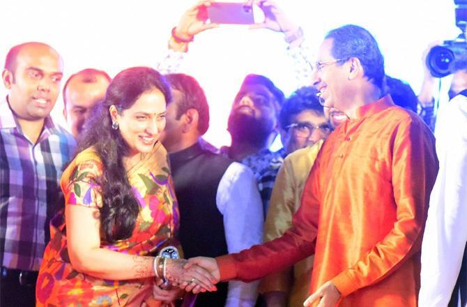 In picture: Maharashtra chief minister Uddhav Thackeray shares a light moment as his wife Rashmi Thackeray congratulates him during his oath taking ceremony as Chief minister of the state