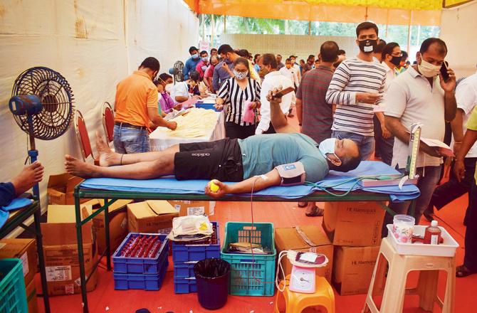 A man donates blood at Maha Raktadan in Prabhadevi on Sunday.
