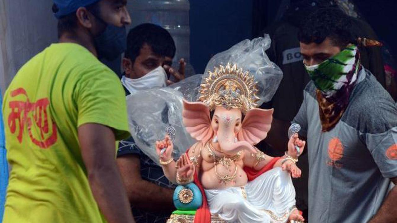 Devotees carry an idol of Lord Ganesha from a workshop in Thakur village in Kandivli.
Photo: Satej Shinde