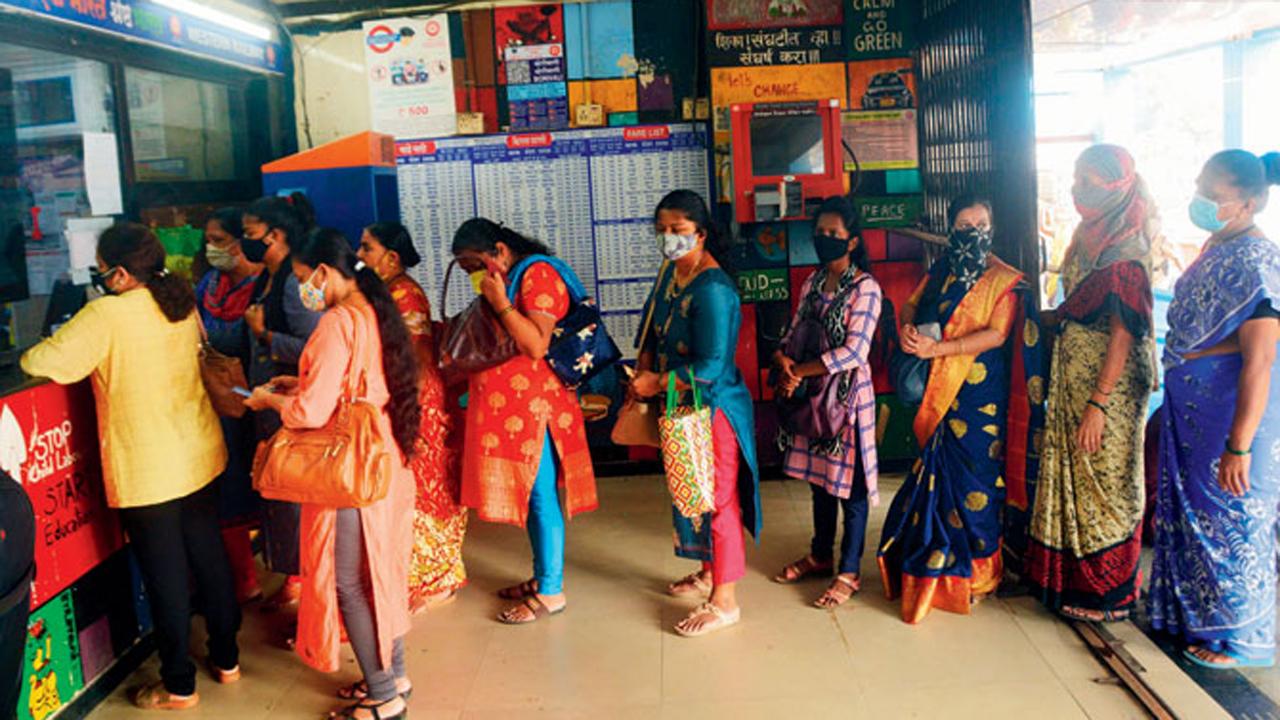 Women passengers queue up outside a ticket counter at Borivli station after they were allowed to travel on Mumbai local trains.
Photo: Satej Shinde