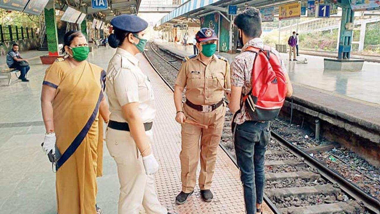 
Police personnel speak to a commuter who seems to be unaware of the Janata Curfew which was announced by Prime Minister Narendra Modi on March 22.
