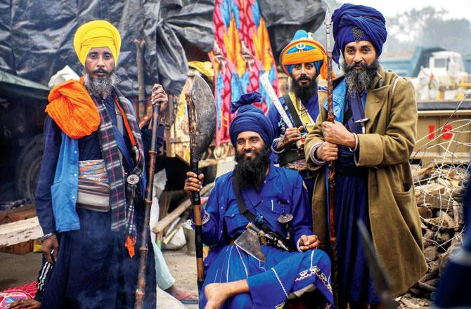 Nihangs at Singhu border during their ‘Delhi Chalo’ march. Pics/AFP