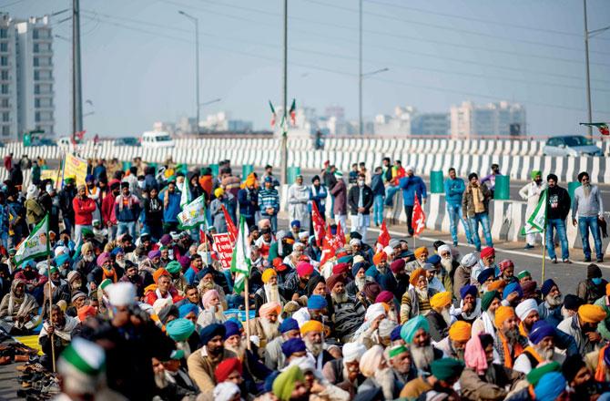 Farmers take part in a demonstration blocking a highway at the Delhi-Uttar Pradesh state border in Ghazipur on Monday. Pic/AFP