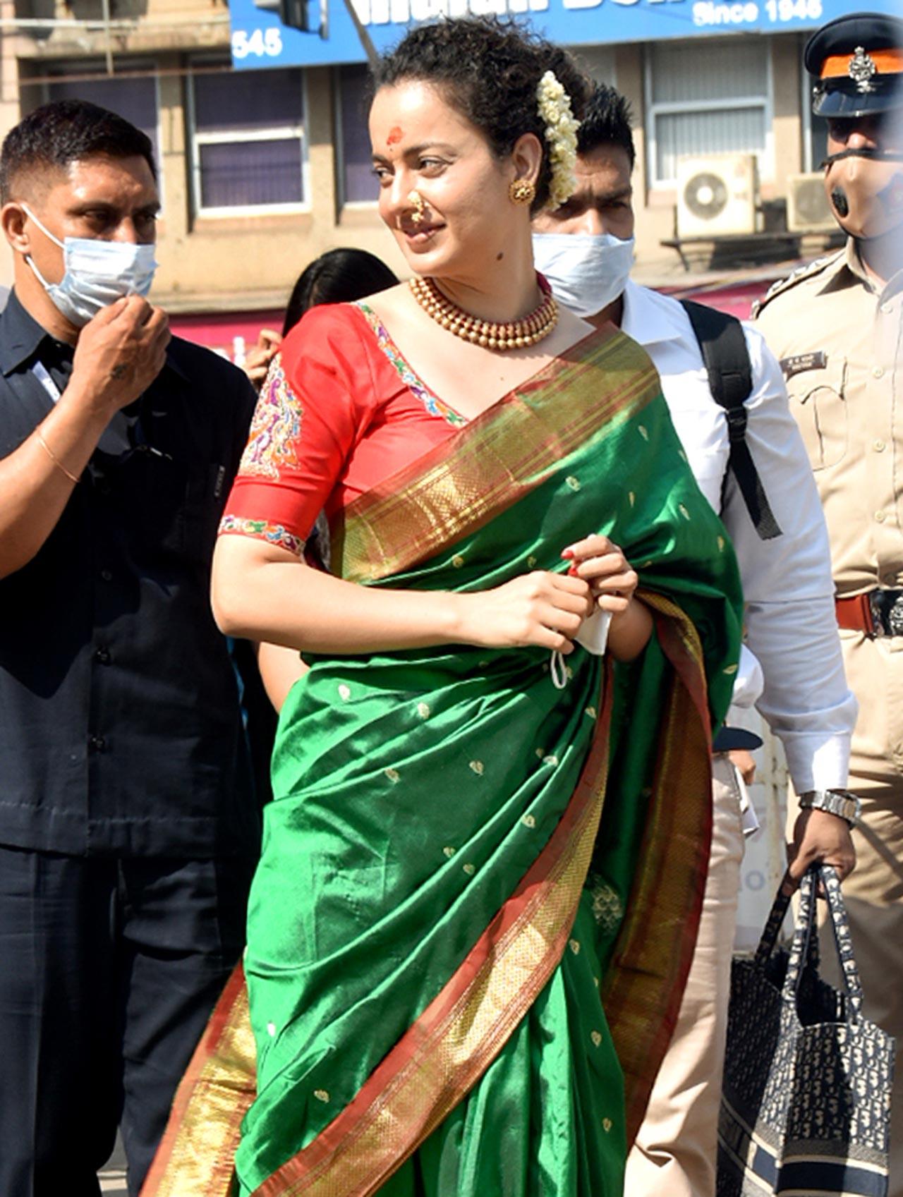 Kangana Ranaut on Tuesday visited the famous Mumba Devi temple and Siddhivinayak Temple in Mumbai. Kangana looked pretty in her green coloured silk saree as she was clicked at Siddhivinayak Temple in Prabhadevi.