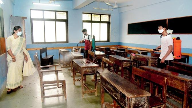 A class at Shindewadi Municipal School in Dadar east being sanitised by BMC in preparation for the opening on November 23, which was deferred later. Pic/Suresh Karkera