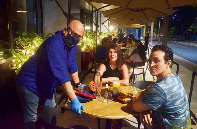 Chef and owner of Qualia, Rahul Akerkar interacts with guests in the new al fresco section. He has ditched elevated dining to include comfort food into the menu in order to reach out to a wider customer demographic. Pics/Ashish Raje