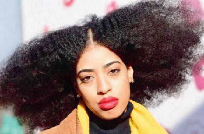 Simone Williams was inspired by the previous record holder, Aevin Dugas, whose hair measured 4 ft 4 inches in circumference. Pics Courtesy/@simonerellbess, Instagram
