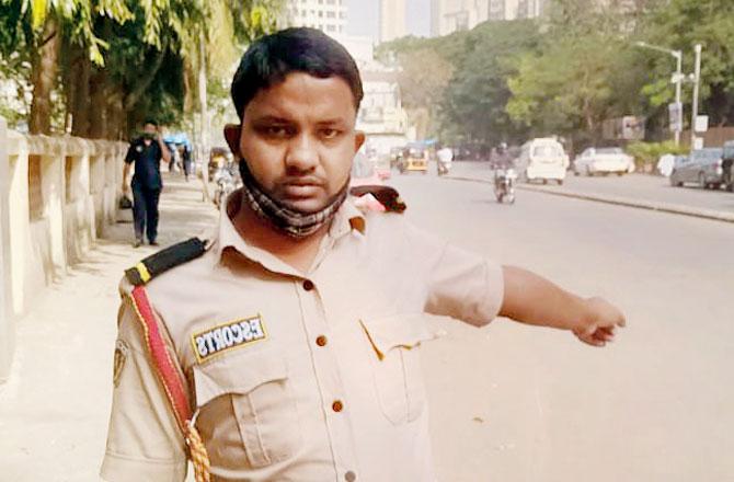 Sunil Gupta, a security guard, points to the divider where the accident happened