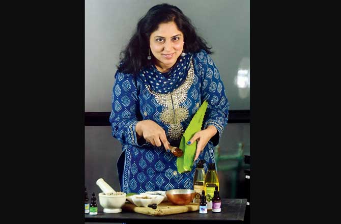 Natasha Tuli, CEO, Soulflower, prepares a concoction of essential oils designed to alleviate menopausal discomfort. In 2012, she launched menopausal roll-ons, but later discontinued the range. "Seeing the recent demand, we might reintroduce it," she says. Pic/Bipin Kokate