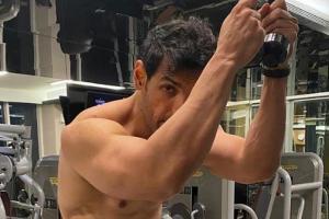 John Abraham flaunts flashboard abs in temperature soaring photograph