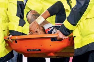 PSG's Neymar is stretchered off after suffering an ankle injury against Lyon on Sunday. Pic/AFP