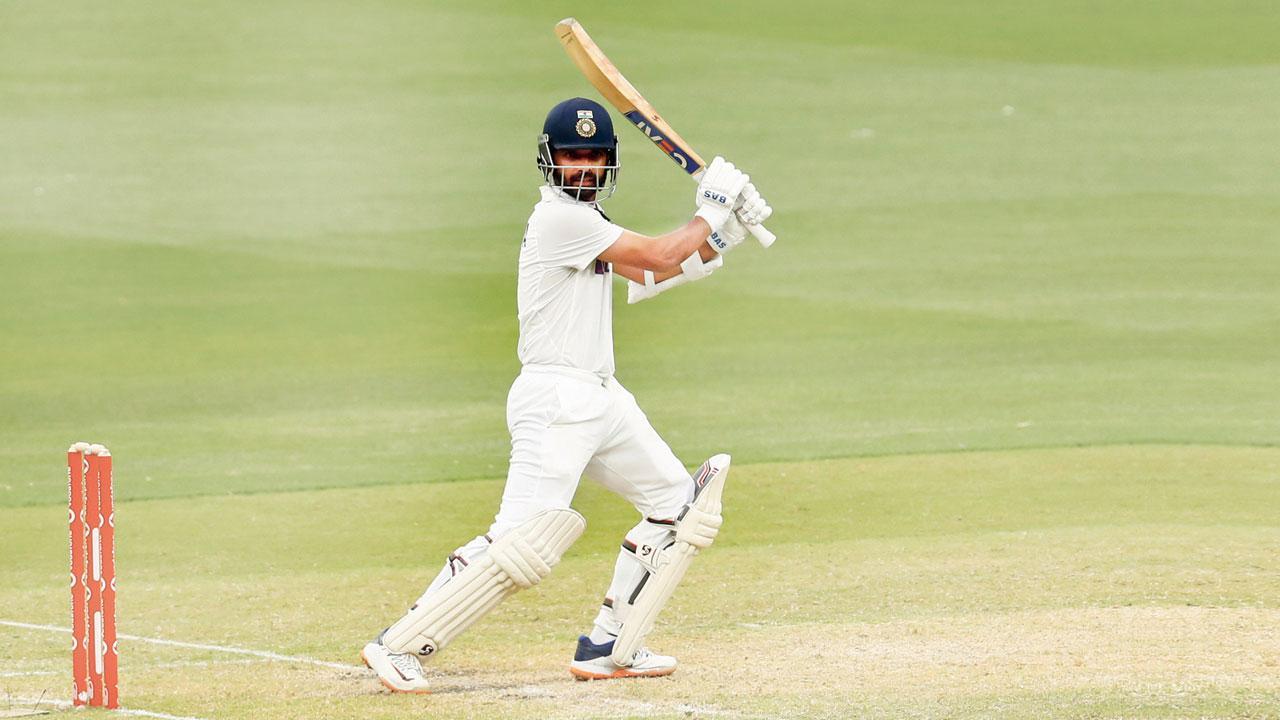 Ajinkya Rahane hits one on the off side to bring up his century on Day Two against Australia at Melbourne yesterday. Pic/Getty Images