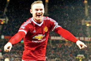 Wayne Rooney's son Kai signs for Man Utd