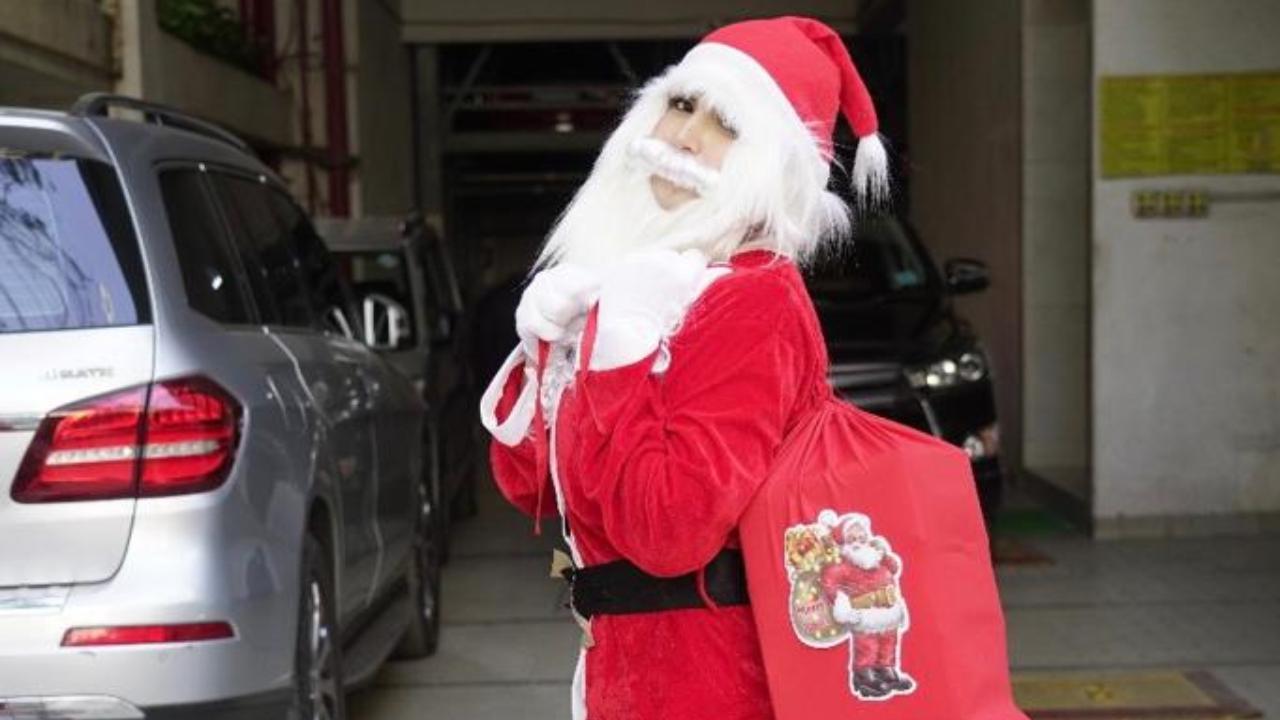 Christmas 2020: Zareen Khan turns into Santa Claus, hands presents to the needy